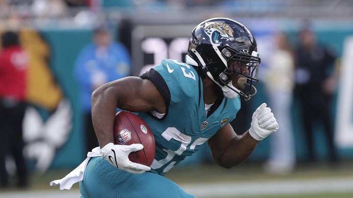Dec 14, 2025; Jacksonville, Florida, USA; Jacksonville Jaguars running back Bhayshul Tuten (33) returns a kick during the third quarter against the New York Jets at EverBank Stadium. Mandatory Credit: Travis Register-Imagn Images