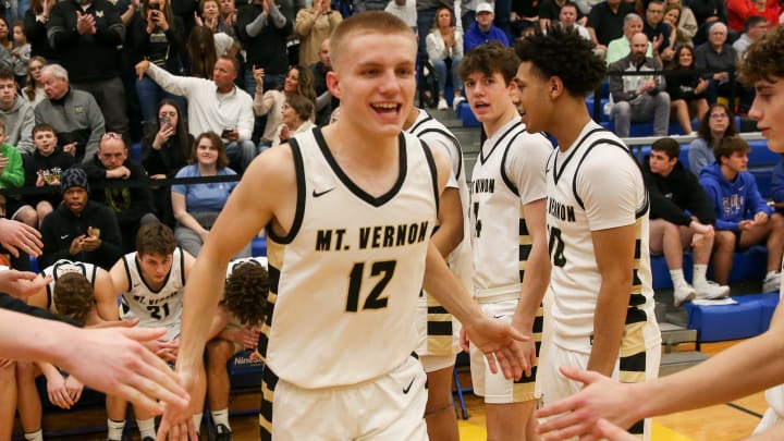 Mt. Vernon Luke Ertel (12) is introduced as the game begins as New Palestine plays Mt. Vernon High School 