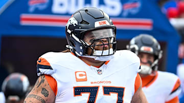 Jan 12, 2025; Orchard Park, New York, USA; Denver Broncos guard Quinn Meinerz (77) enters the field before an AFC wild card game against the Buffalo Bills at Highmark Stadium. Mandatory Credit: Mark Konezny-Imagn Images