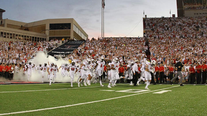 Sep 16, 2017; Lubbock, TX, USA; Texas Tech Red Raiders head coach Kliff Kingsbury leads his team onto the field before the game against the Arizona State Sun Devils at Jones AT&T Stadium. Mandatory Credit: Michael C. Johnson-Imagn Images