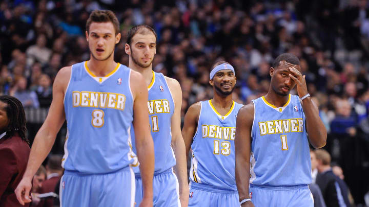 Denver Nuggets small forward Danilo Gallinari (8) and center Kosta Koufos (41) and small forward Corey Brewer (13) and small forward Jordan Hamilton (1) take the court to face the Dallas Mavericks at the American Airlines Center. 