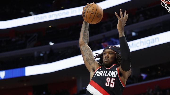 Nov 1, 2023; Detroit, Michigan, USA;  Portland Trail Blazers center Robert Williams III (35) grabs the rebound over Detroit Pistons guard Killian Hayes (7) in the first half at Little Caesars Arena. Mandatory Credit: Rick Osentoski-USA TODAY Sports