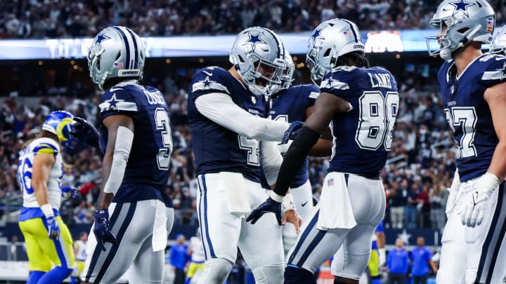 Oct 29, 2023; Arlington, Texas, USA; Dallas Cowboys wide receiver CeeDee Lamb (88) celebrates with Dallas Cowboys quarterback Dak Prescott (4) after catching a touchdown  pass during the first half against the Los Angeles Rams at AT&T Stadium. 