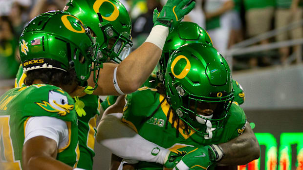 Oregon running back Noah Whittington celebrates a touchdown as the Oregon Ducks host the Boise State Broncos Saturday, Sept. 