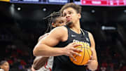 Mar 13, 2025; Kansas City, MO, USA; Colorado Buffaloes center Elijah Malone (50) drives to the basket during the second half against the Houston Cougars at T-Mobile Center. Mandatory Credit: William Purnell-Imagn Images