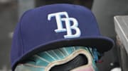 Sep 26, 2025; Toronto, Ontario, CAN; The hat and glove of Tampa Bay Rays third baseman Junior Caminero (13) in the dugout during the game against the Toronto Blue Jays at Rogers Centre. 