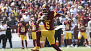 Sep 15, 2024; Landover, Maryland, USA; Washington Commanders quarterback Jayden Daniels (5) runs down the field in the first half against the New York Giants at Commanders Field. Mandatory Credit: Luke Johnson-Imagn Images

