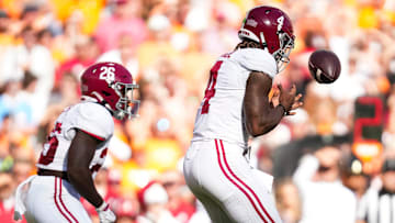 Alabama quarterback Jalen Milroe (4) fumbles the snap during an SEC conference game between Tennessee and Alabama in Neyland Stadium on Saturday, Oct. 19, 2024.