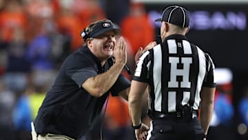 Oct 11, 2025; Auburn, Alabama, USA;  Georgia Bulldogs head coach Kirby Smart tries to tell an official that he did not call a time out during the fourth quarter against the Auburn Tigers at Jordan-Hare Stadium. Mandatory Credit: John Reed-Imagn Images