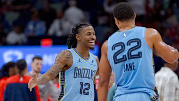Dec 27, 2024; New Orleans, Louisiana, USA;  Memphis Grizzlies guard Ja Morant (12) reacts with Memphis Grizzlies guard Desmond Bane (22) at halftime against the Memphis Grizzlies at Smoothie King Center. Mandatory Credit: Matthew Hinton-Imagn Images
