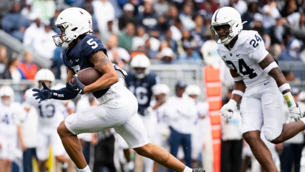 Penn State wide receiver Omari Evans scores a 28-yard touchdown during the 2023 Blue-White Game at Beaver Stadium.