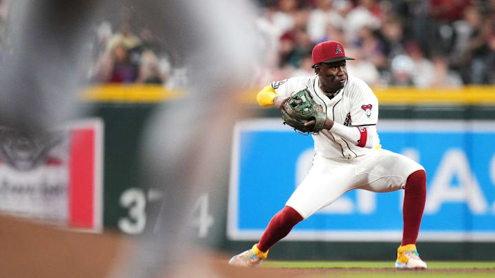 Arizona Diamondbacks infielder Geraldo Perdomo (2) fields a ground ball and throws to second base during their Opening Day game against the Chicago Cubs at Chase Field in Phoenix on March 27, 2025.