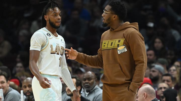 Dec 10, 2022; Cleveland, Ohio, USA; Cleveland Cavaliers guard Darius Garland, left, talks to guard Donovan Mitchell during the second half against the Oklahoma City Thunder at Rocket Mortgage FieldHouse. Mandatory Credit: Ken Blaze-USA TODAY Sports