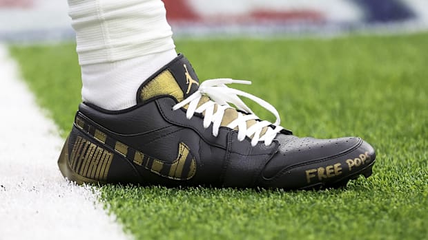 Houston Texans quarterback C.J. Stroud's black and gold Air Jordan cleats.