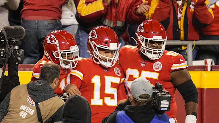 Dec 5, 2021; Kansas City, Missouri, USA; Kansas City Chiefs quarterback Patrick Mahomes (15) celebrates with wide receiver Demarcus Robinson (11) and guard Trey Smith (65) after scoring a touchdown against the Denver Broncos during the first half at GEHA Field at Arrowhead Stadium. Mandatory Credit: Jay Biggerstaff-Imagn Images