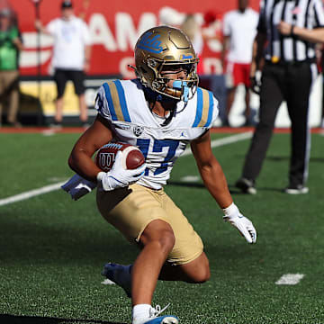 Sep 23, 2023; Salt Lake City, Utah, USA; UCLA Bruins wide receiver Logan Loya (17) runs with the ball after a catch against the Utah Utes in the fourth quarter at Rice-Eccles Stadium. Mandatory Credit: Rob Gray-Imagn Images