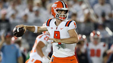 Sep 28, 2024; University Park, Pennsylvania, USA; Illinois Fighting Illini quarterback Luke Altmyer (9) throws a pass during the first quarter against the Penn State Nittany Lions at Beaver Stadium. Mandatory Credit: Matthew O'Haren-Imagn Images