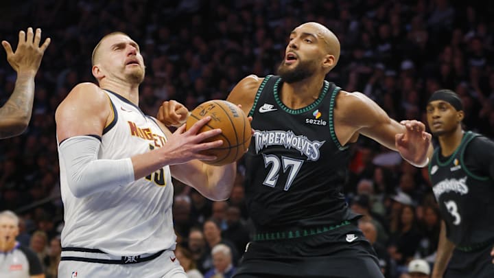 Apr 23, 2026; Minneapolis, Minnesota, USA; Denver Nuggets center Nikola Jokic (15) goes to the basket against Minnesota Timberwolves center Rudy Gobert (27) in the third quarter at Target Center. Mandatory Credit: Bruce Kluckhohn-Imagn Images
