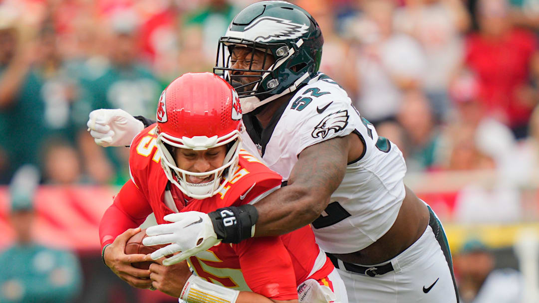Sep 14, 2025; Kansas City, Missouri, USA; Philadelphia Eagles defensive end Za'Darius Smith (52) sacks Kansas City Chiefs quarterback Patrick Mahomes (15) during the second quarter of the game at GEHA Field at Arrowhead Stadium.