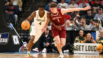 Mar 22, 2024; Memphis, TN, USA; Baylor Bears guard Ja'Kobe Walter (4) dribbles against Colgate Raiders guard Brady Cummins (1) during the first half of the NCAA Tournament First Round at FedExForum. Mandatory Credit: Petre Thomas-USA TODAY Sports