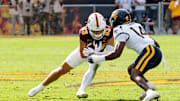 West Virginia Mountaineers Kekoura Tarnue (14) attempts to block Arizona State Sun Devils Derek Eusebio (83) during a game at Mountain America Stadium in Tempe on Nov. 15, 2025.