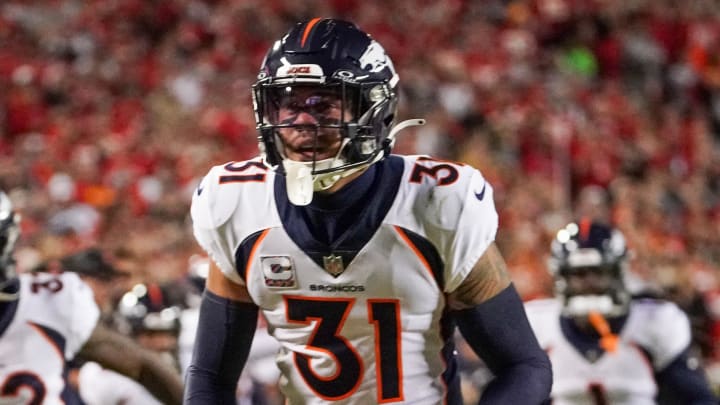 Oct 12, 2023; Kansas City, Missouri, USA; Denver Broncos safety Justin Simmons (31) celebrates after making an interception against the Kansas City Chiefs during the first half at GEHA Field at Arrowhead Stadium. Mandatory Credit: Denny Medley-USA TODAY Sports