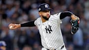 Oct 8, 2025; Bronx, New York, USA; New York Yankees pitcher Devin Williams (38) pitches during the seventh inning against the Toronto Blue Jays during game four of the ALDS round for the 2025 MLB playoffs at Yankee Stadium. Mandatory Credit: Brad Penner-Imagn Images