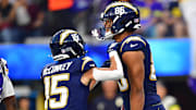 Oct 23, 2025; Inglewood, California, USA; Los Angeles Chargers tight end Oronde Gadsden II (86) reacts after scoring a touchdown with wide receiver Ladd McConkey (15) during the first half at SoFi Stadium. Mandatory Credit: Gary A. Vasquez-Imagn Images