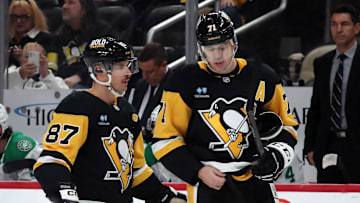 Nov 11, 2024; Pittsburgh, Pennsylvania, USA;  Pittsburgh Penguins center Sidney Crosby (87) and center Evgeni Malkin (71) react on the ice against the Dallas Stars during the third period at PPG Paints Arena. Mandatory Credit: Charles LeClaire-Imagn Images
