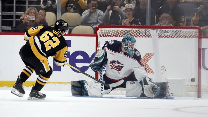 Sep 24, 2023; Pittsburgh, Pennsylvania, USA;  Pittsburgh Penguins center Brayden Yager (62) scores a goal against Columbus Blue Jackets goaltender Aaron Dell (35) in the shootout at PPG Paints Arena. Pittsburgh won 3-2 in a shootout. Mandatory Credit: Charles LeClaire-USA TODAY Sports