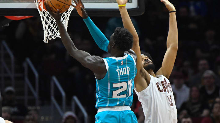 Apr 14, 2024; Cleveland, Ohio, USA; Cleveland Cavaliers center Jarrett Allen (31) defends a shot by Charlotte Hornets forward JT Thor (21) in the second quarter at Rocket Mortgage FieldHouse. Mandatory Credit: David Richard-USA TODAY Sports