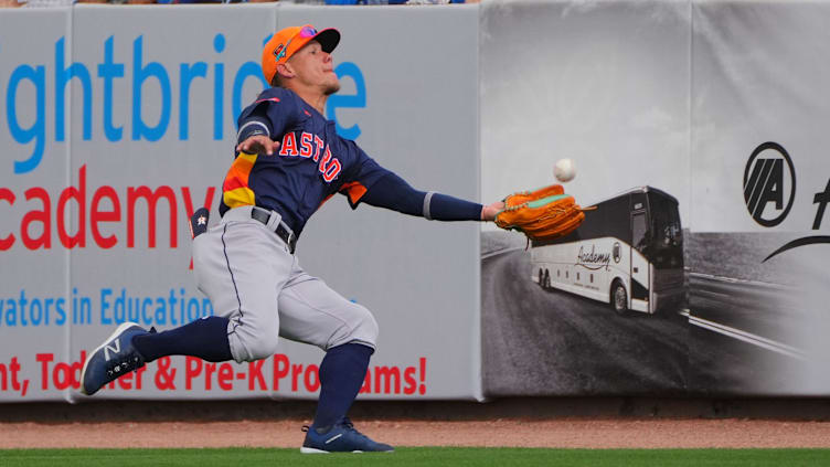 Mar 3, 2024; Port St. Lucie, Florida, USA; Houston Astros center fielder Kenedy Corona (89) makes a lunging catch in foul territory against the New York Mets in the third inning at Clover Park. Mandatory Credit: Jim Rassol-USA TODAY Sports