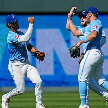 Sep 8, 2024; Kansas City, Missouri, USA; Kansas City Royals left fielder MJ Melendez (1) and center fielder Kyle Isbel (28) and right fielder Hunter Renfroe (16) celebrate after defeating the Minnesota Twins at Kauffman Stadium. Mandatory Credit: Jay Biggerstaff-Imagn Images