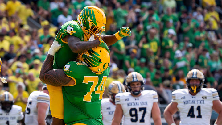 Oregon wide receiver Gary Bryant Jr., left, celebrates a touchdown with offensive lineman Dave Iuli as the Oregon Ducks host the Montana State Bobcats on Aug. 30, 2025, at Autzen Stadium in Eugene, Oregon.