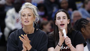 Jun 7, 2025; Chicago, Illinois, USA; Injured Indiana Fever guard Sophie Cunningham (8) and guard Caitlin Clark (22) react from the bench during the first half of a WNBA game against the Chicago Sky at United Center. Mandatory Credit: Kamil Krzaczynski-Imagn Images