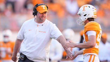 Tennessee coach Josh Heupel high-fives Tennessee place kicker Max Gilbert (90) during a college football game between Tennessee and Arkansas at Neyland Stadium in Knoxville, Tenn., on Oct. 11, 2025.