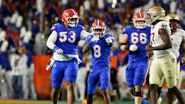 Nov 29, 2025; Gainesville, Florida, USA; Florida Gators wide receiver Vernell Brown III (8) gestures with Florida Gators offensive lineman Bryce Lovett (53) and Florida Gators offensive lineman Jake Slaughter (66) after a first down against the Florida State Seminoles during the first half at Ben Hill Griffin Stadium. Mandatory Credit: Matt Pendleton-Imagn Images