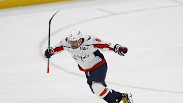 Apr 6, 2025; Elmont, New York, USA;  Washington Capitals left wing Alex Ovechkin (8) scores a goal in the 2nd period against the New York Islanders at UBS Arena. The goal is the 895th of Ovechkin’s career, breaking the NHL all-time career goals record previously held by Wayne Gretzky.at UBS Arena. Mandatory Credit: Geoff Burke-Imagn Images