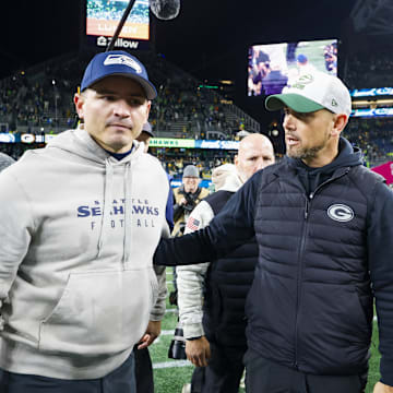 Dec 15, 2024; Seattle, Washington, USA; Seattle Seahawks head coach Mike Macdonald, left, talks with Green Bay Packers head coach Matt LaFleur following a Green Bay victory at Lumen Field. 