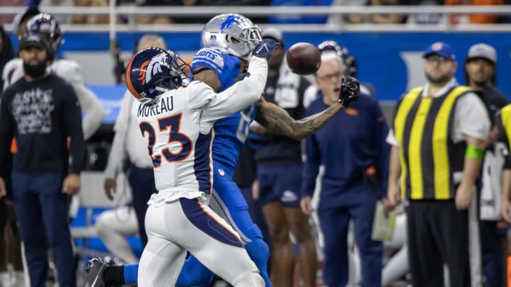 Dec 16, 2023; Detroit, Michigan, USA; Denver Broncos cornerback Fabian Moreau (23) is called for pass interference on Detroit Lions wide receiver Josh Reynolds (8) in the second half at Ford Field.