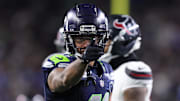 Oct 20, 2025; Seattle, Washington, USA; Seattle Seahawks wide receiver Jaxon Smith-Njigba (11) celebrates after a first down during the third quarter against the Houston Texans at Lumen Field. Mandatory Credit: Kevin Ng-Imagn Images