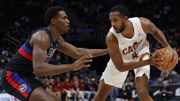 Mar 1, 2024; Detroit, Michigan, USA;  Cleveland Cavaliers forward Evan Mobley (4) dribbles against Detroit Pistons center Jalen Duren (0) in the second half at Little Caesars Arena. Mandatory Credit: Rick Osentoski-USA TODAY Sports