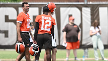 Jun 10, 2025; Berea, OH, USA; Cleveland Browns quarterback Joe Flacco (15) talks to quarterback Shedeur Sanders (12) during minicamp at CrossCountry Mortgage Campus. Mandatory Credit: Ken Blaze-Imagn Images