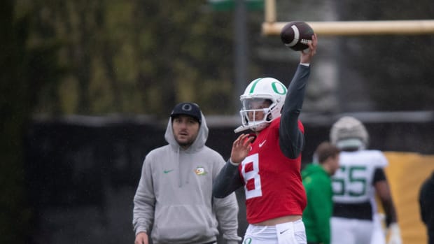 Oregon quarterback Dillon Gabriel throws during practice 