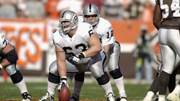 Barret Robbins snaps the ball to Rich Gannon