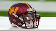 Nov 16, 2025; Madrid, Spain; Helmets are seen prior to the 2025 NFL Madrid Game between the Miami Dolphins and the Washington Commanders at Santiago Bernabeu Stadium. Mandatory Credit: Kirby Lee-Imagn Images