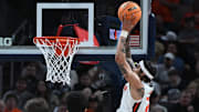 Mar 13, 2025; Indianapolis, IN, USA; Illinois Fighting Illini guard Tre White (22) goes up for a dunk during the second half against the Iowa Hawkeyes at Gainbridge Fieldhouse. Mandatory Credit: Robert Goddin-Imagn Images