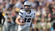 Sep 21, 2024; West Point, New York, USA; Rice Owls quarterback E.J. Warner (13) runs with the ball against the Army Black Knights during the first half at Michie Stadium. Mandatory Credit: Danny Wild-Imagn Images