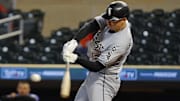 Chicago White Sox shortstop Colson Montgomery (12) hits a two-run home run against the Minnesota Twins at Target Field.