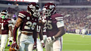 Mississippi State Bulldogs defensive back Dwight Lewis III (26) and defensive lineman Ray Thomas (25) celebrate after a touchdown against the Alcorn State Braves during the second half at Davis Wade Stadium at Scott Field.